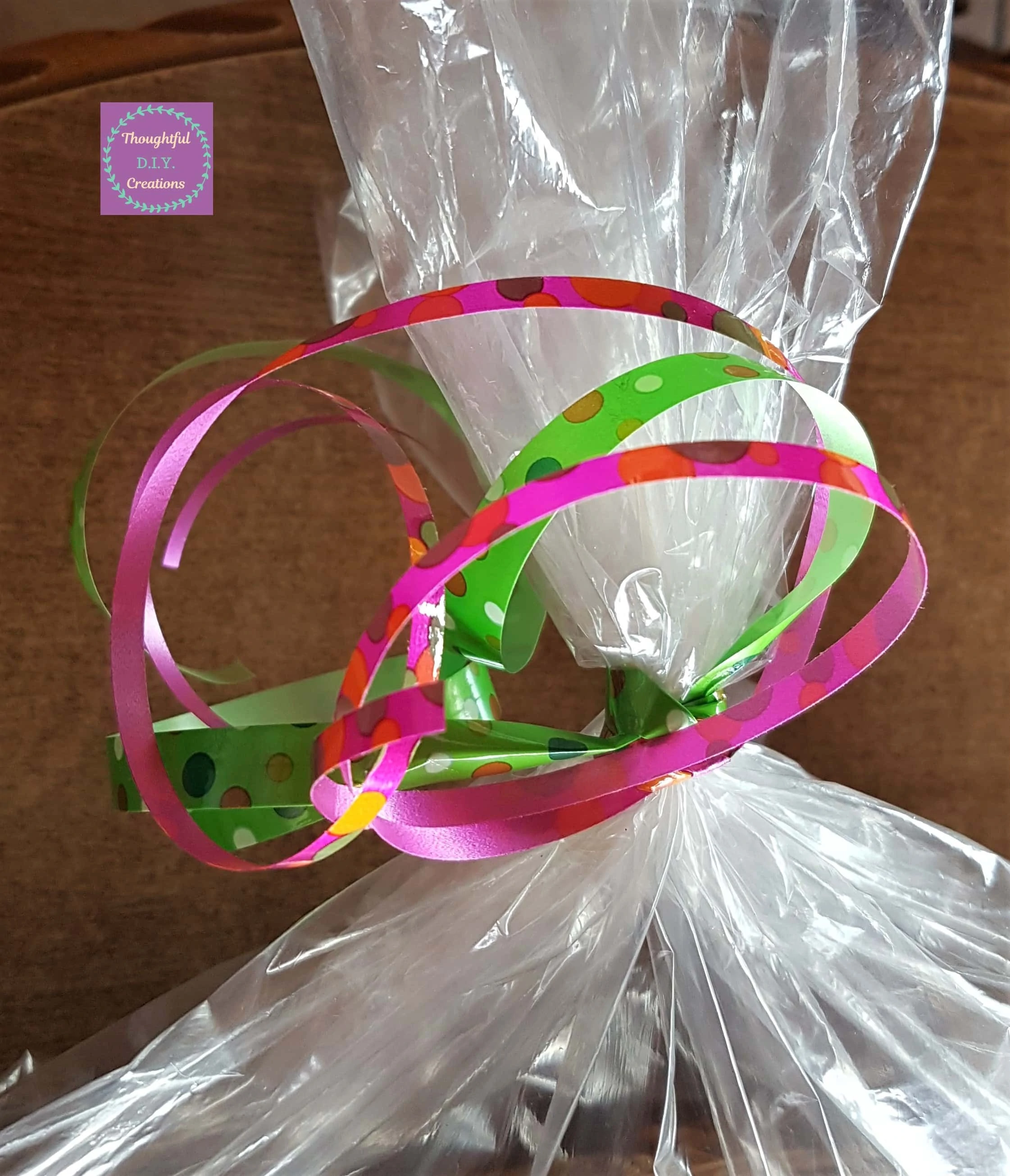 I Cut a section of Pink and Green Ribbons and tied them around the elastic band.