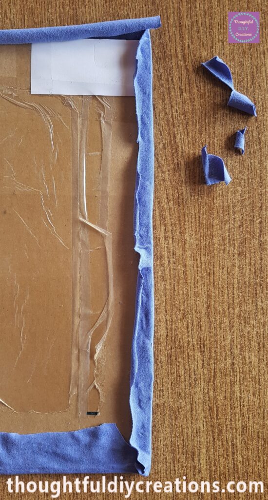 I repeated this Step on the long side of the Cardboard. I cut away the excess material.