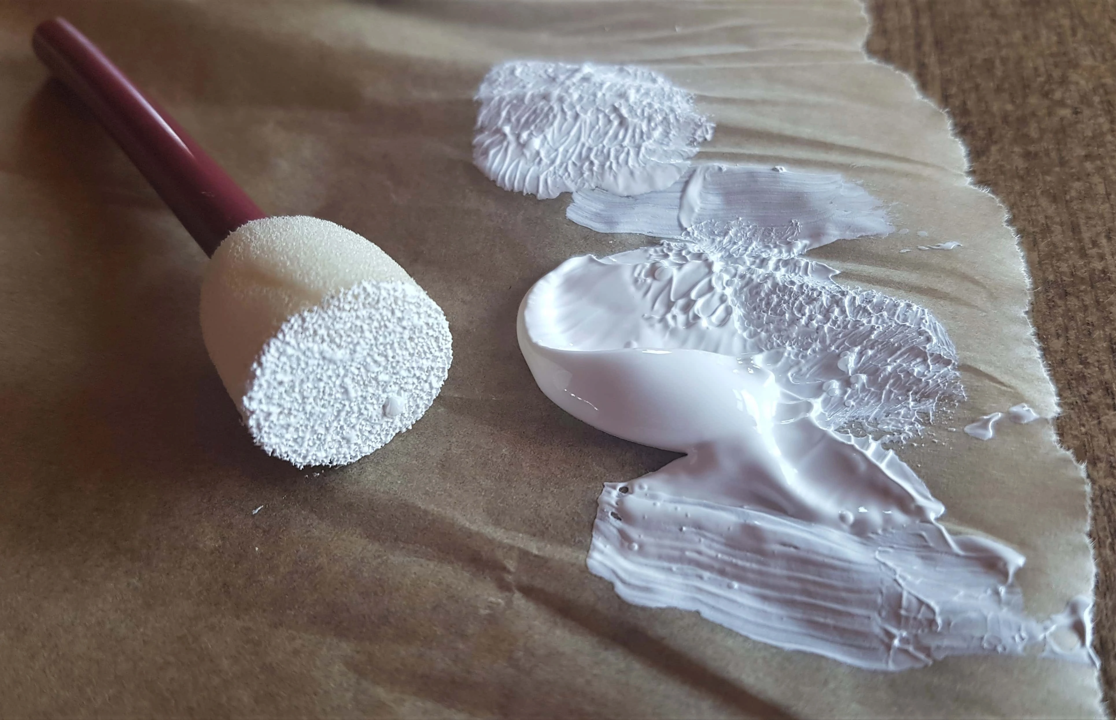 I dipped the sponge into the Gesso and dabbed the excess Gesso onto another part of the Paper to prevent having too much on the Sponge.