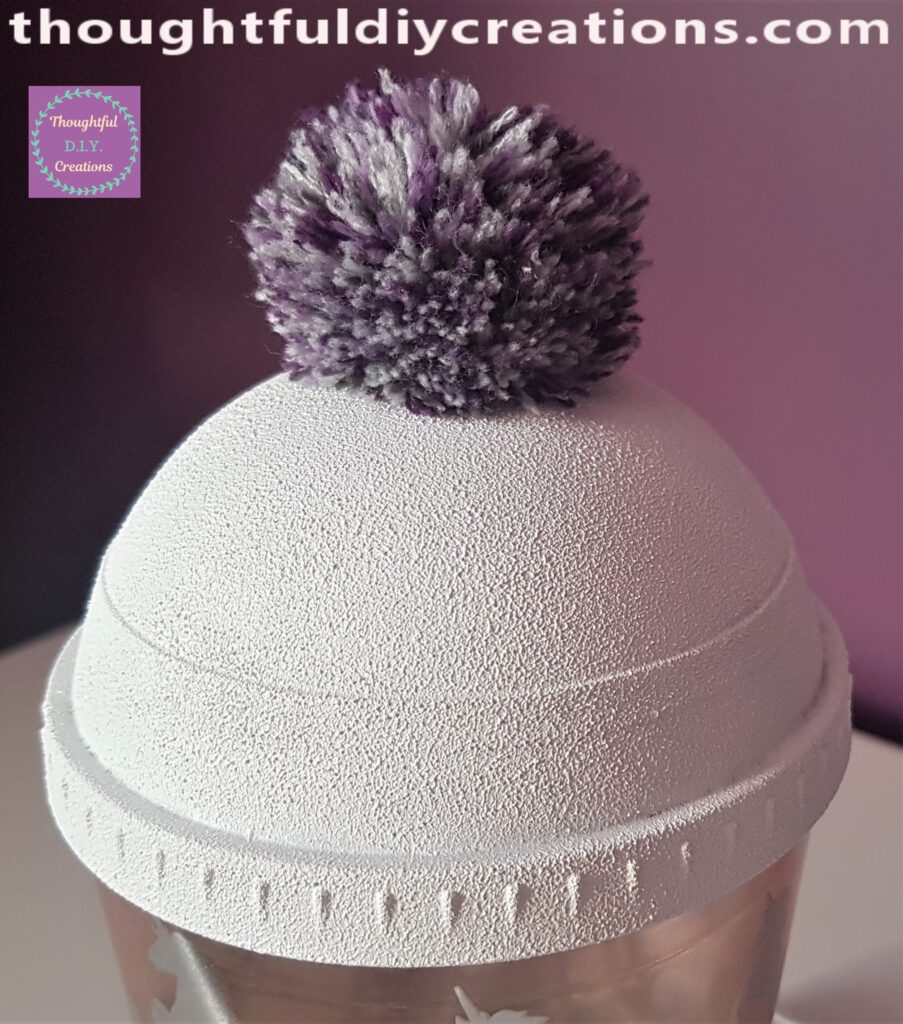 I put some Hot Glue all around the outer circle on the Beaker and held the Pom Pom in place until it was secure.