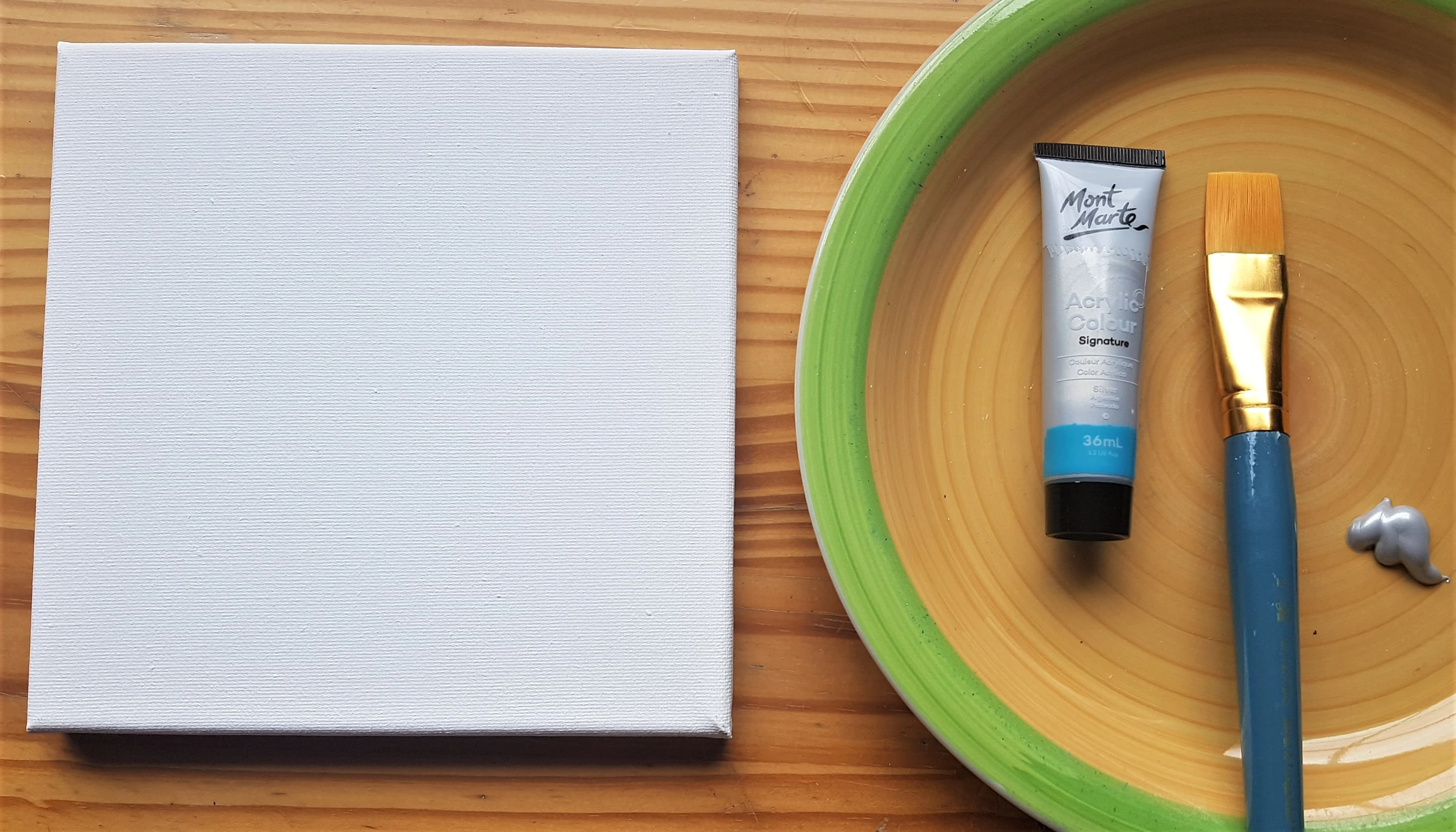 I got a 1 inch Paintbrush and poured some Silver Paint onto the Plate.