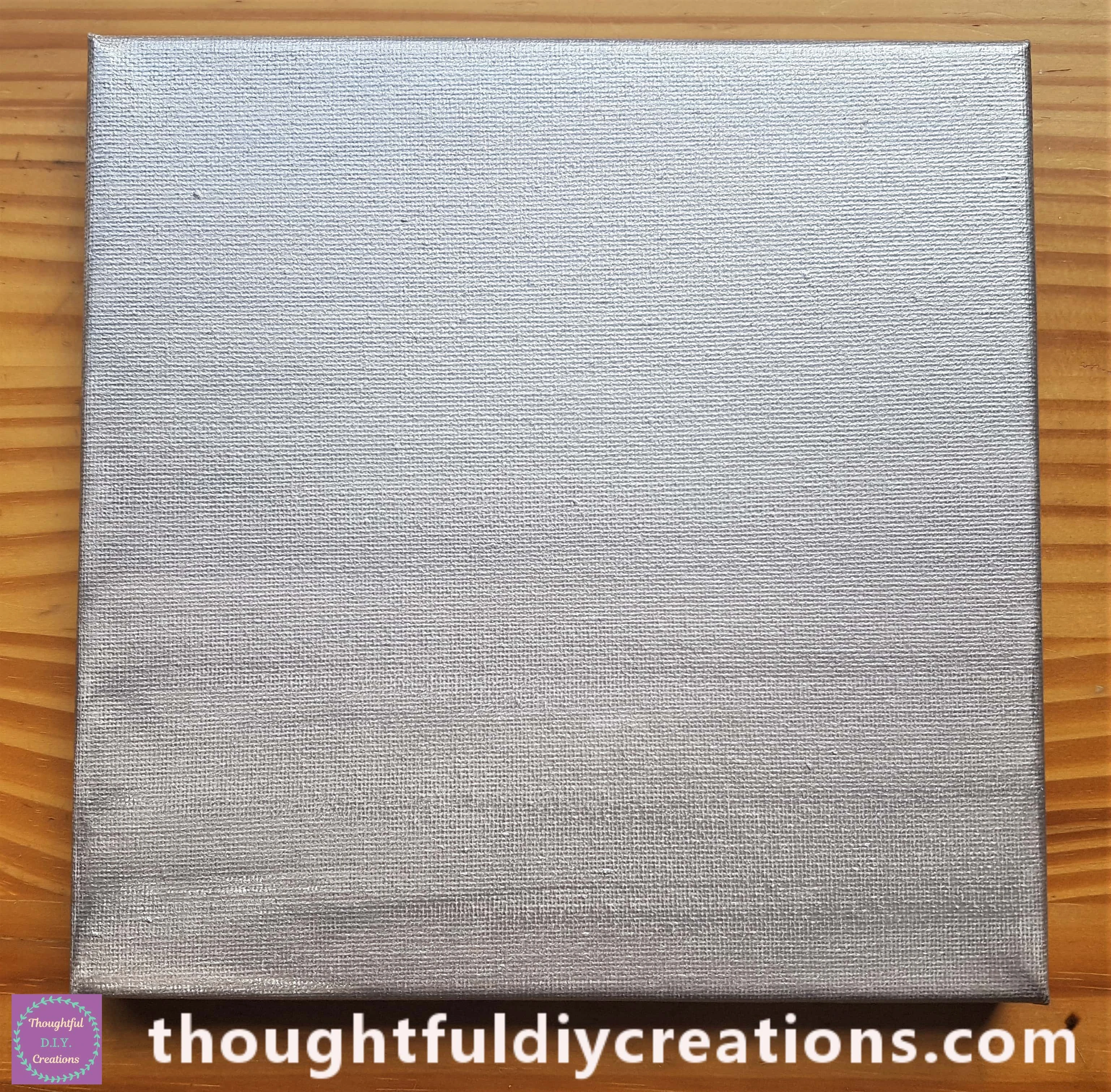 I Painted a thin even layer of Silver Paint onto the Front and Sides of the Canvas.