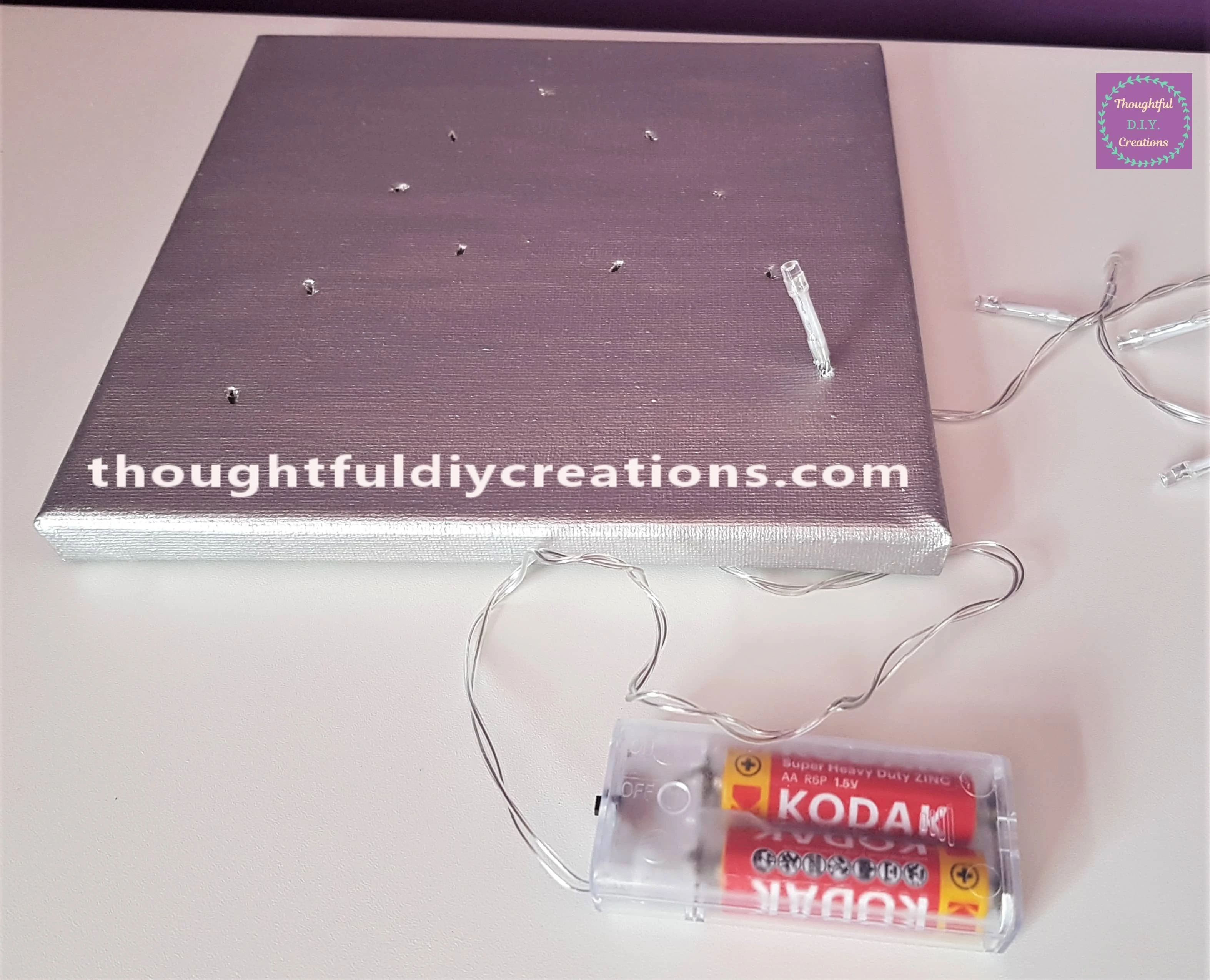 How the Front of the Canvas looks with the Light poked through the Hole.