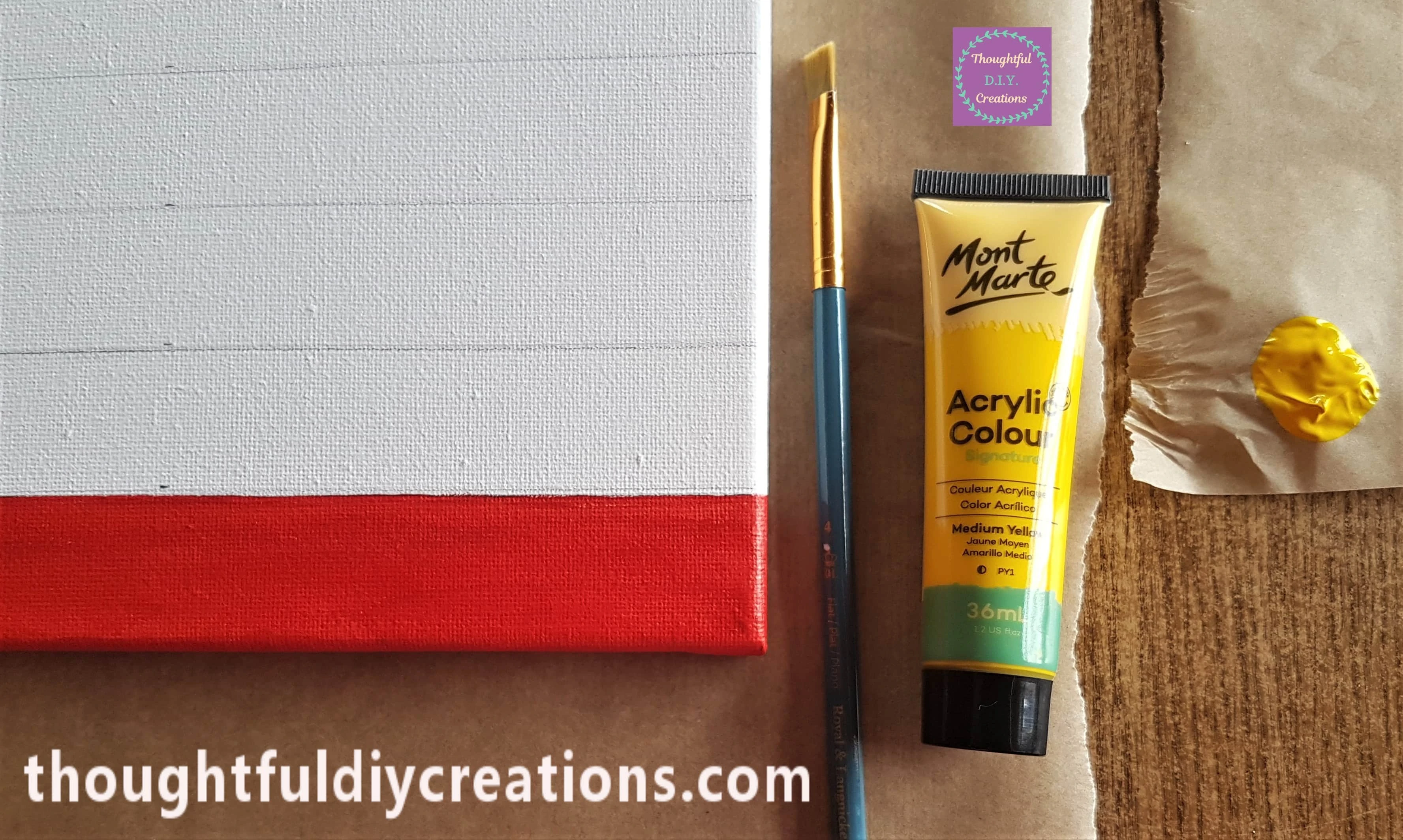 I got another flat paintbrush and poured some Yellow Acrylic Paint onto the Baking Paper.