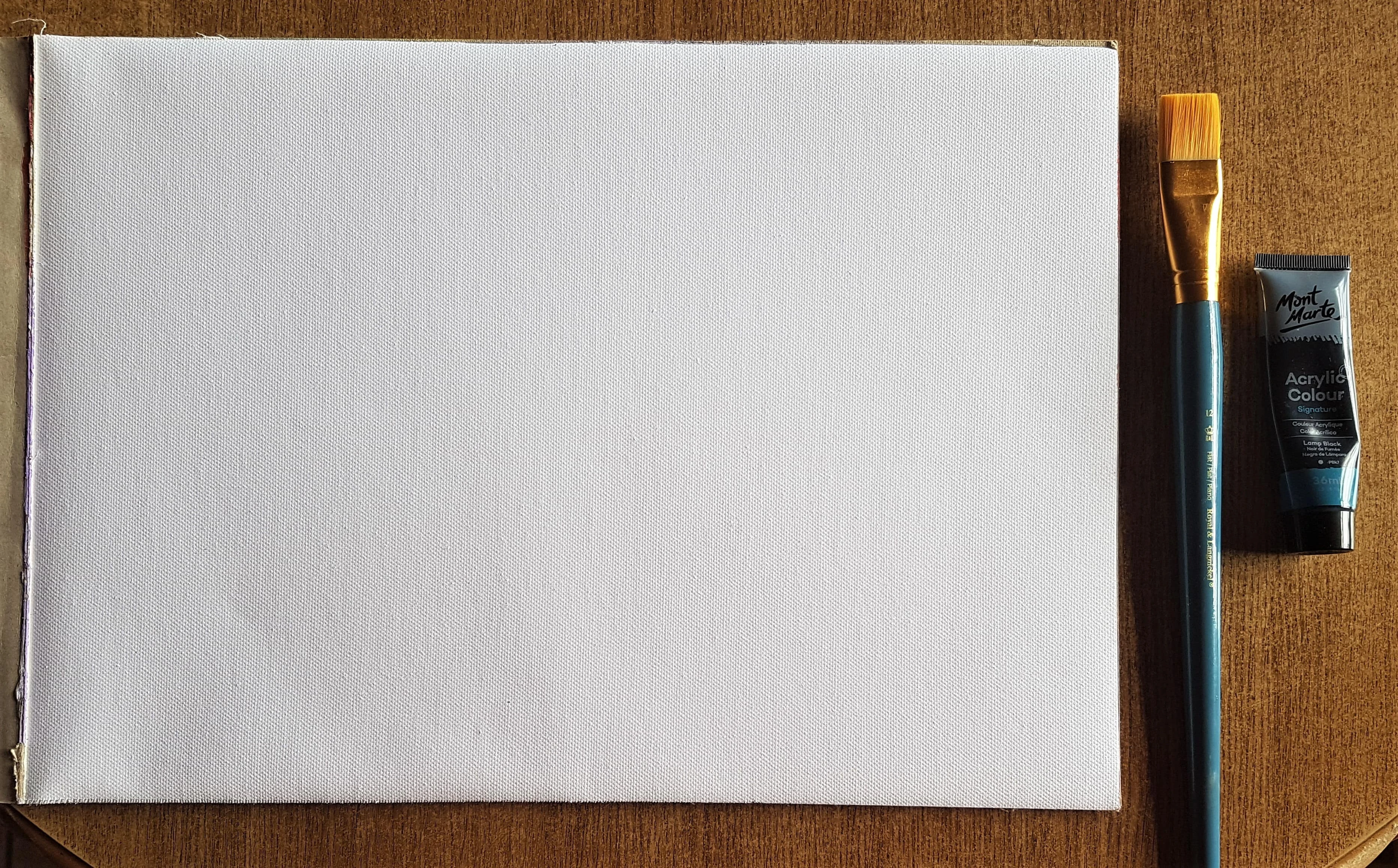 I got my Watercolour Pad a big, flat Paintbrush and Black Acrylic Paint.