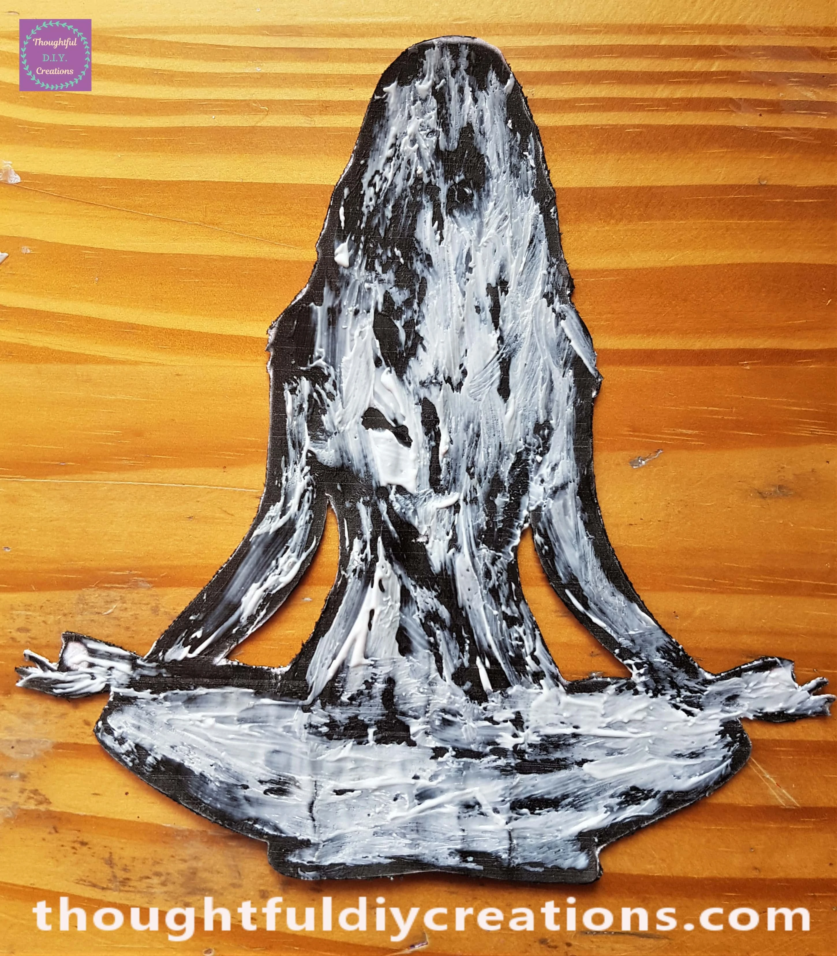 I put Anita's Tacky PVA Glue all over the back of the Silhouette with a Paintbrush.