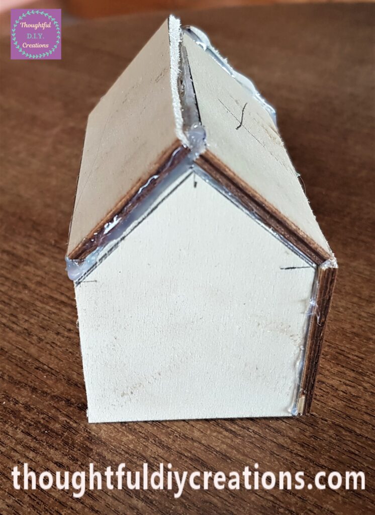 Each edge of the Roof pieces were hot glued in place.