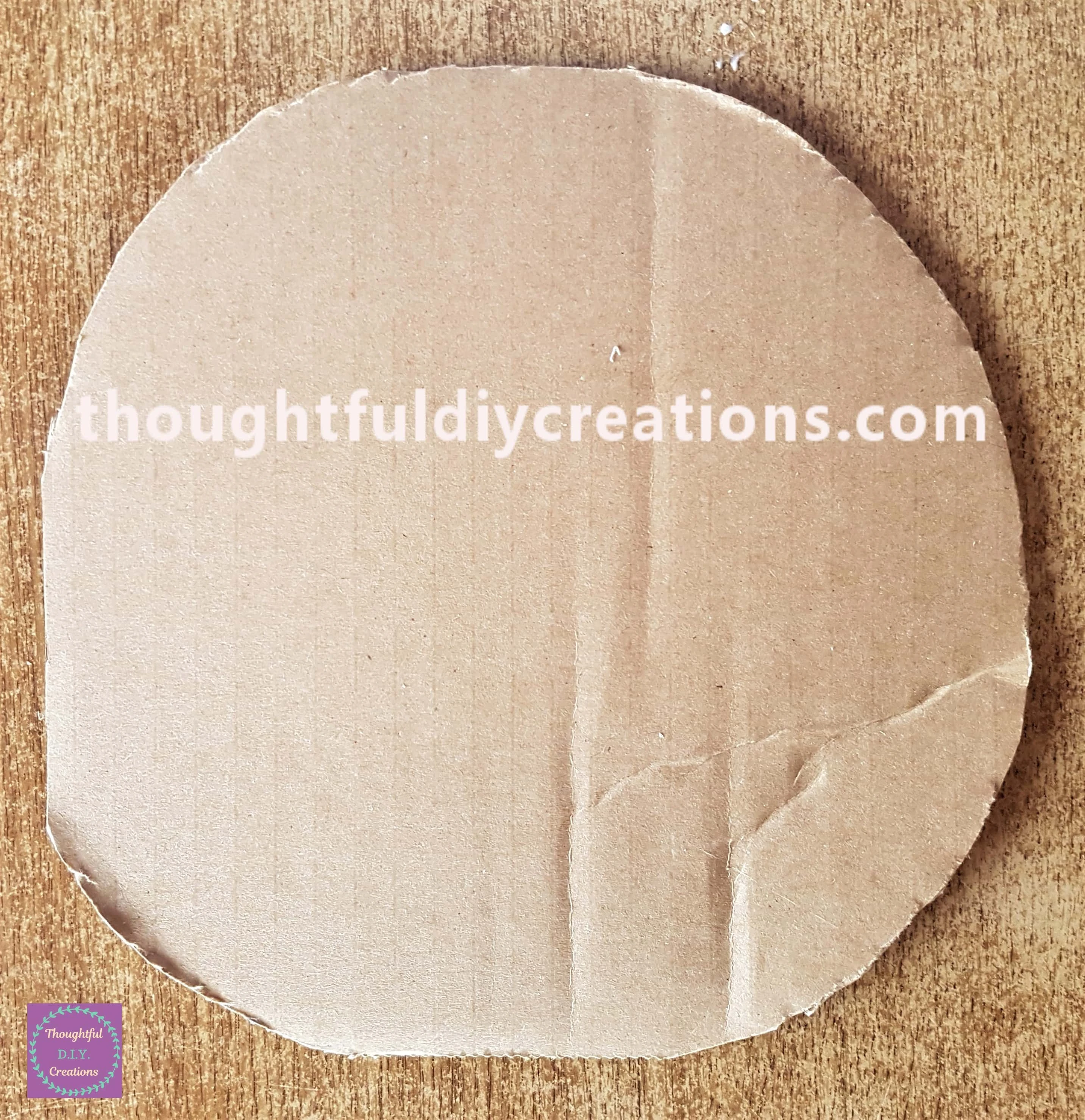 I cut around the measurements on the cardboard and made a circular shape.