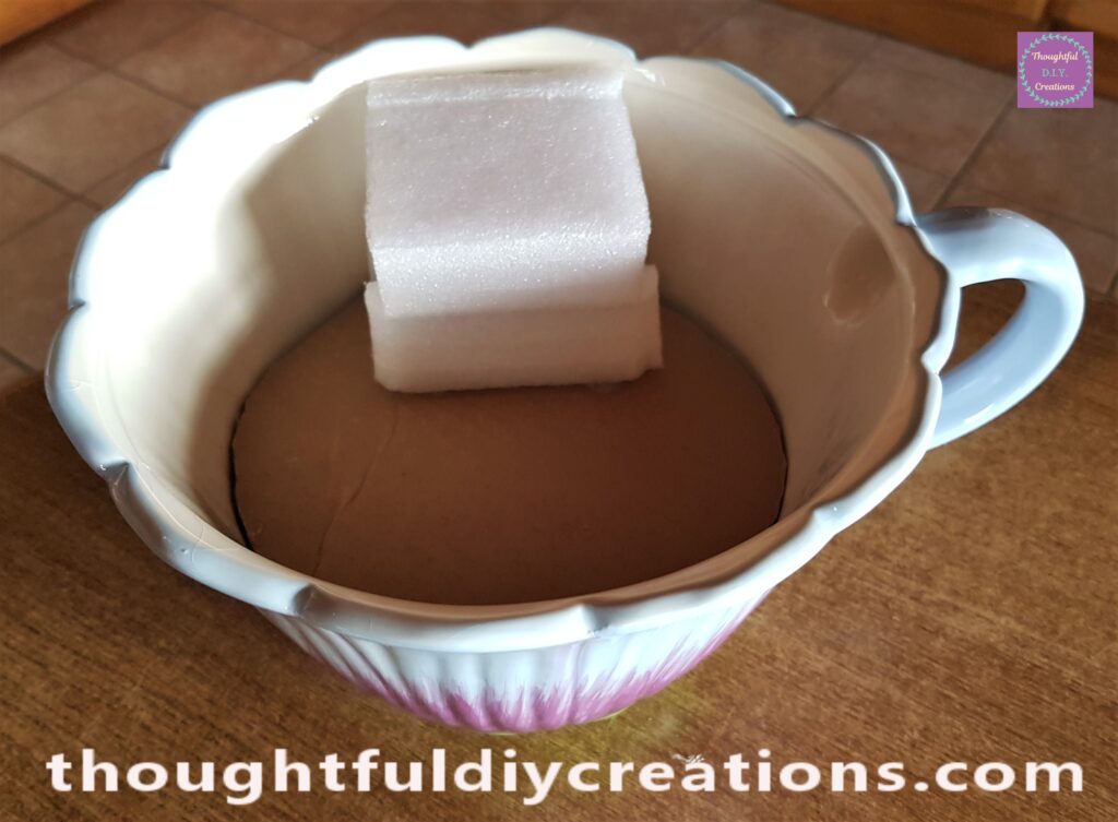 I Cut off the other big side of foam and hot glued it to the cardboard.