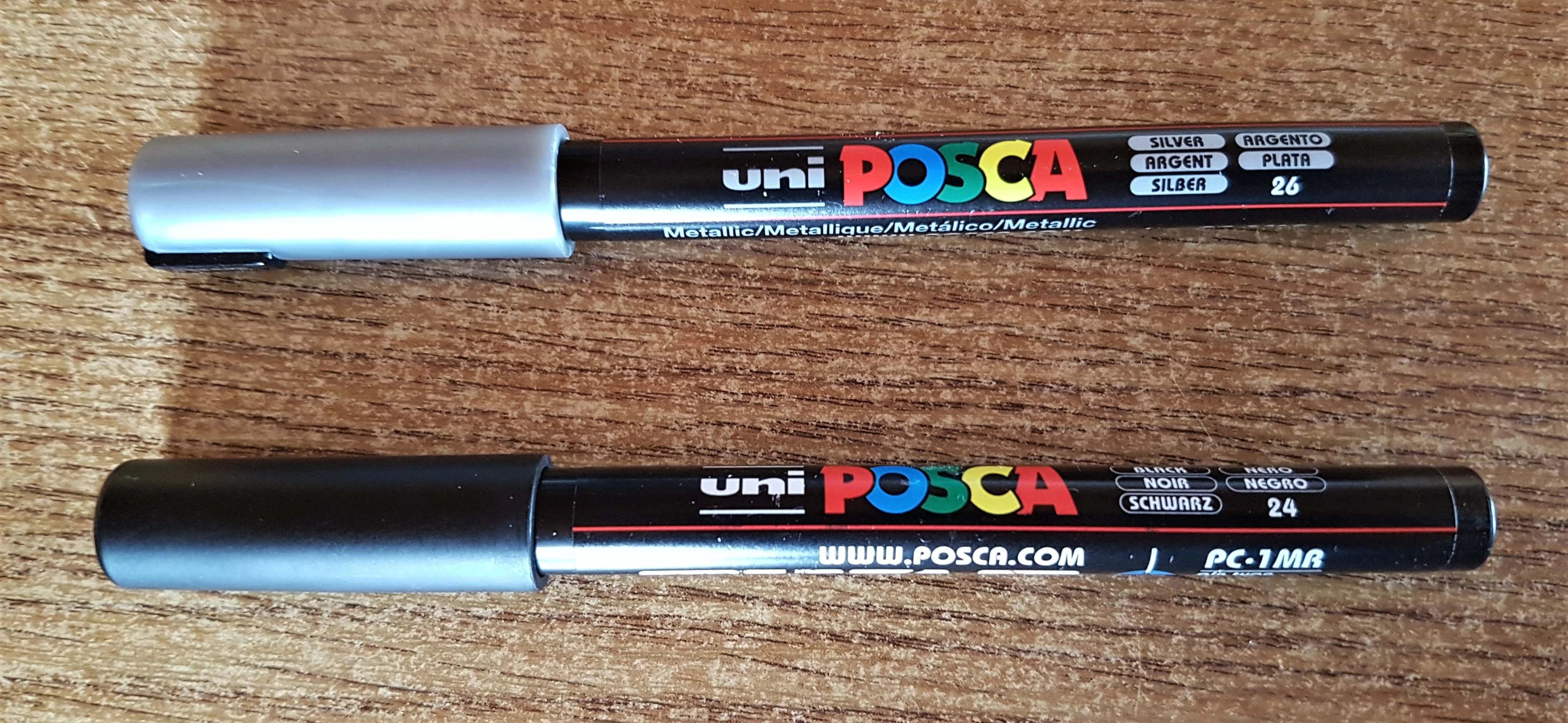 I used my silver paint pen for the door knob and my black paint pen to draw the windows.