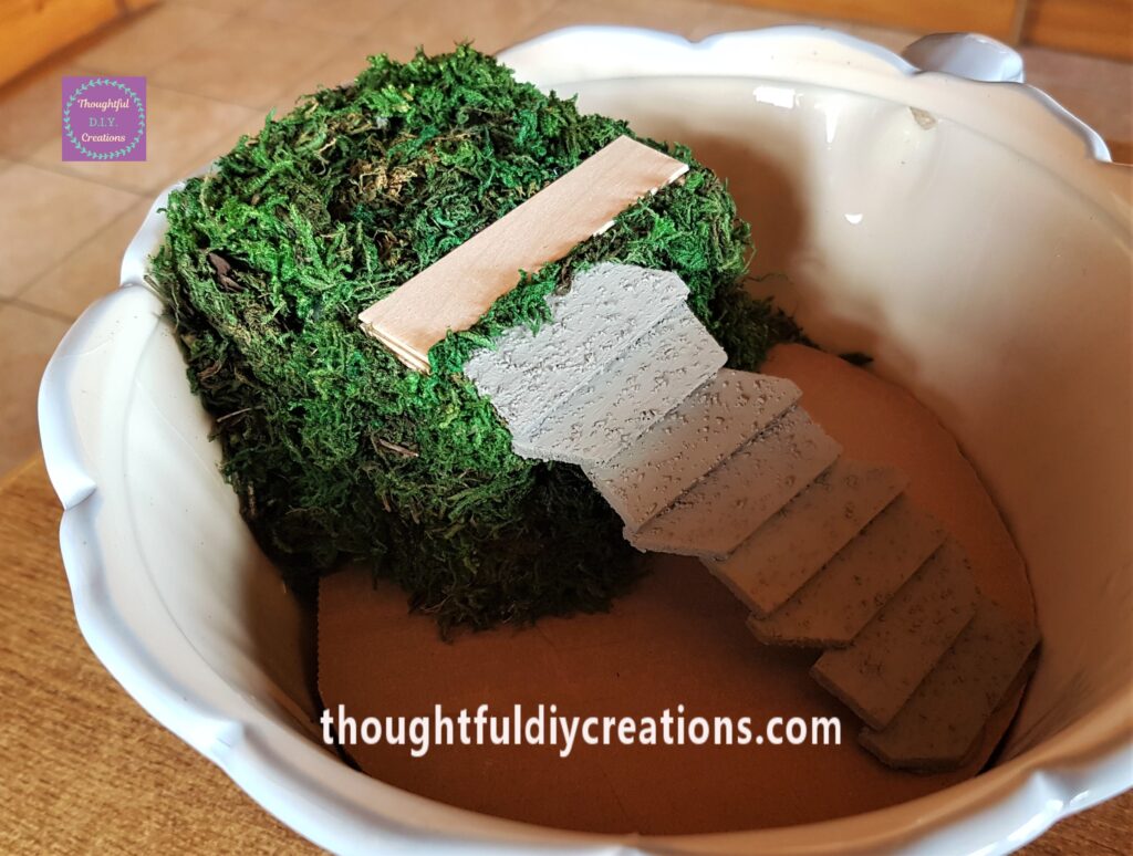I Continued to add more moss to the right side, underneath the steps as well as the left side of the foam.