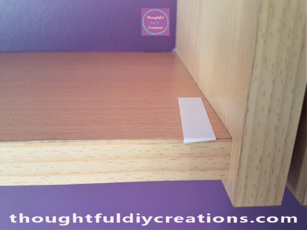 I put another Section of Double-Sided Tape on the other end of the Shelf.