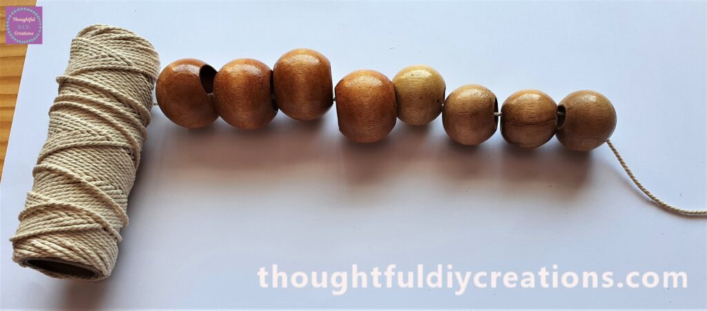 Next I added the 4 Medium Wooden Beads.