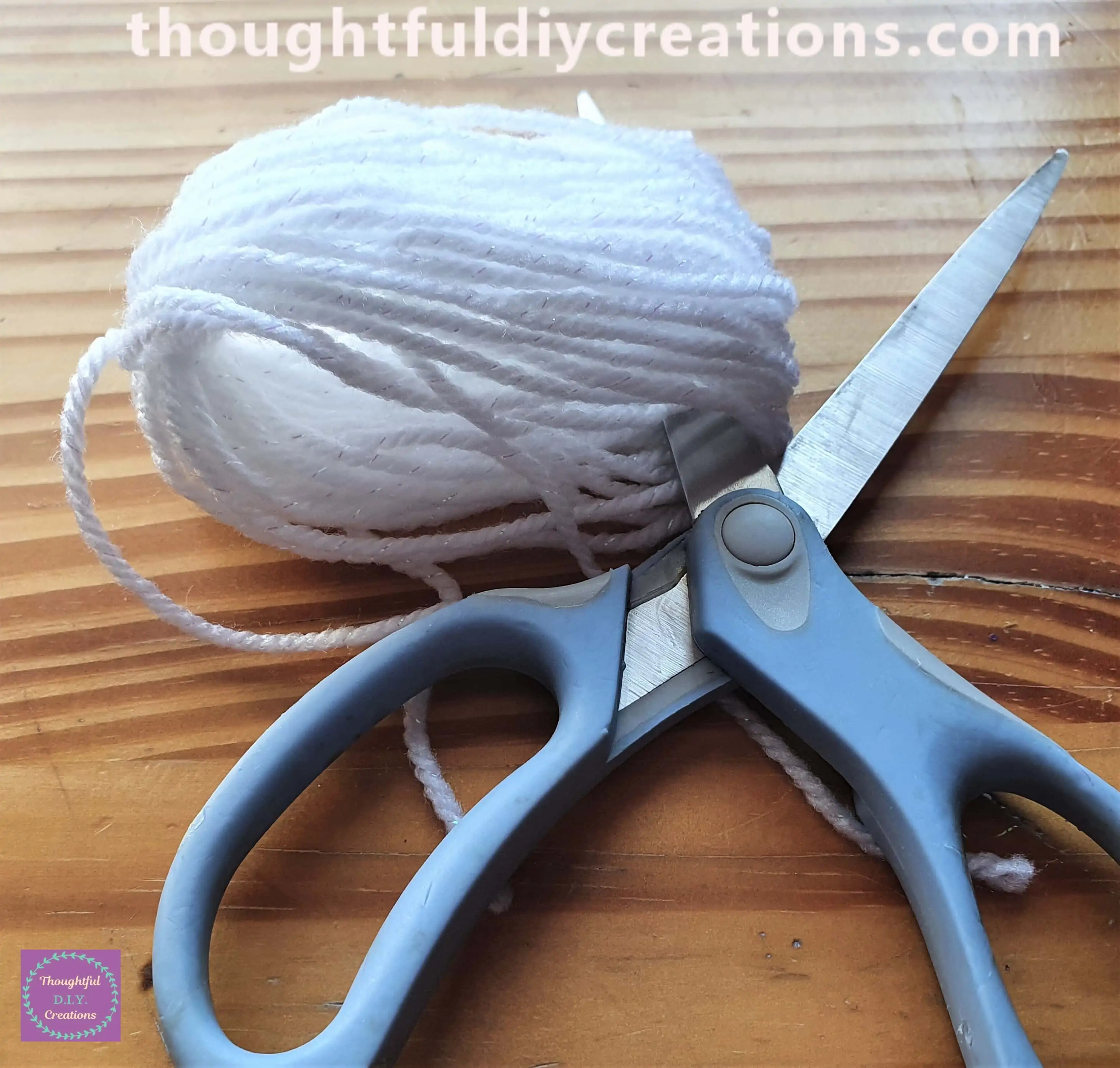 I put one blade of scissors inside the bottom of the Wool bundle.