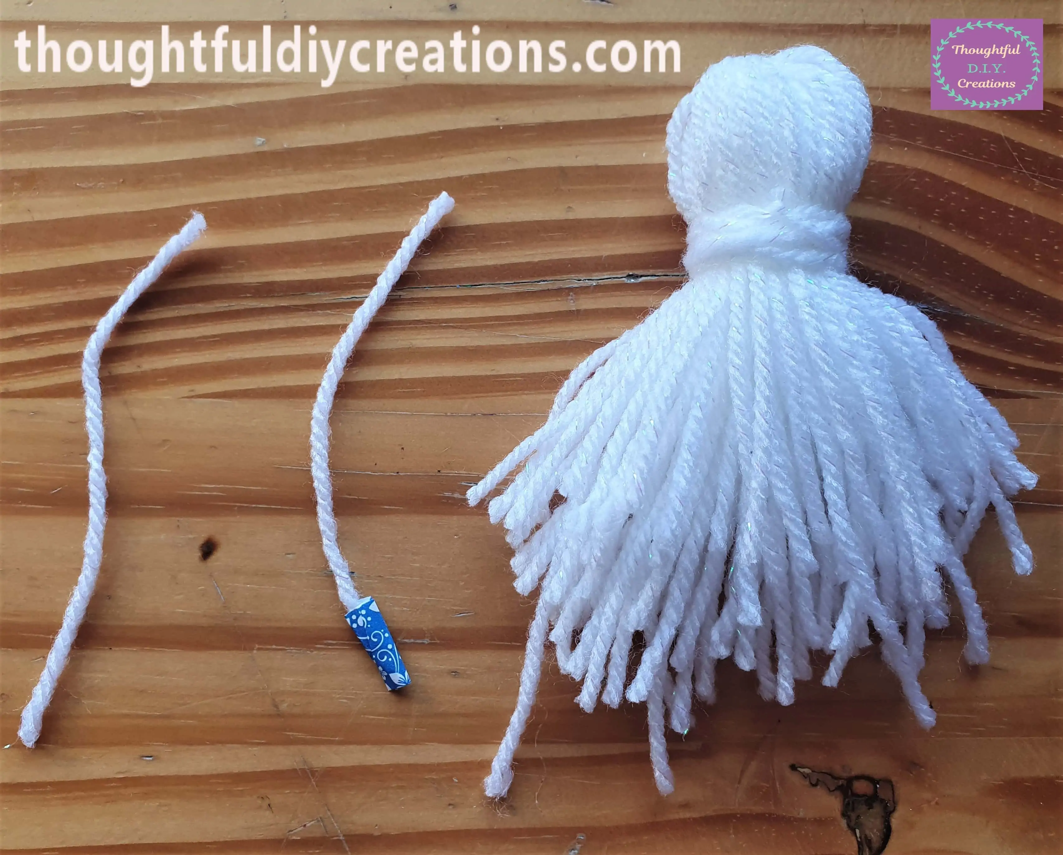 I Cut off the String of Wool beside the Knot as well as the excess String with the washi-tape on it.