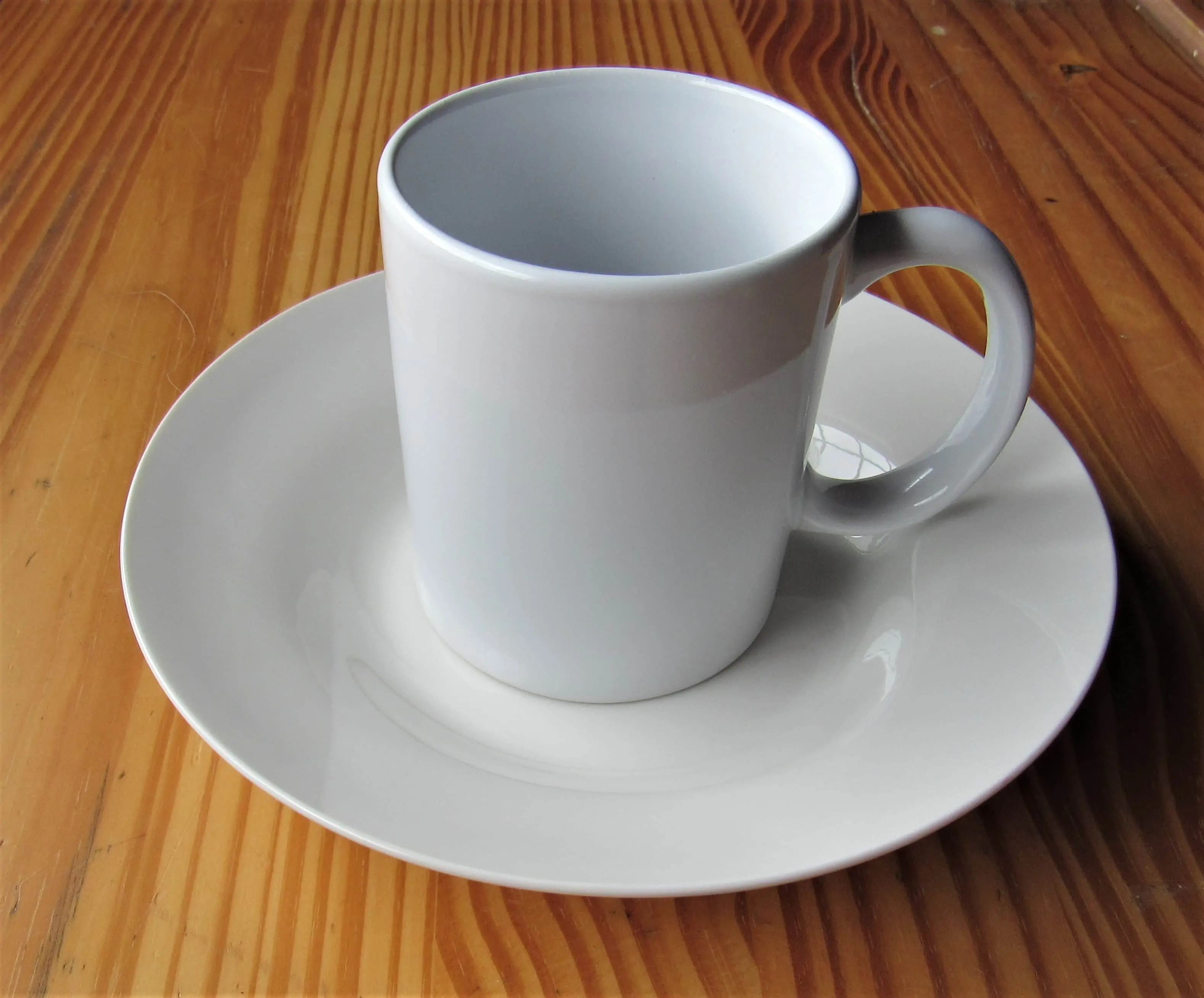 I removed the Sticker from the Cup and Plate and then washed and dried them.