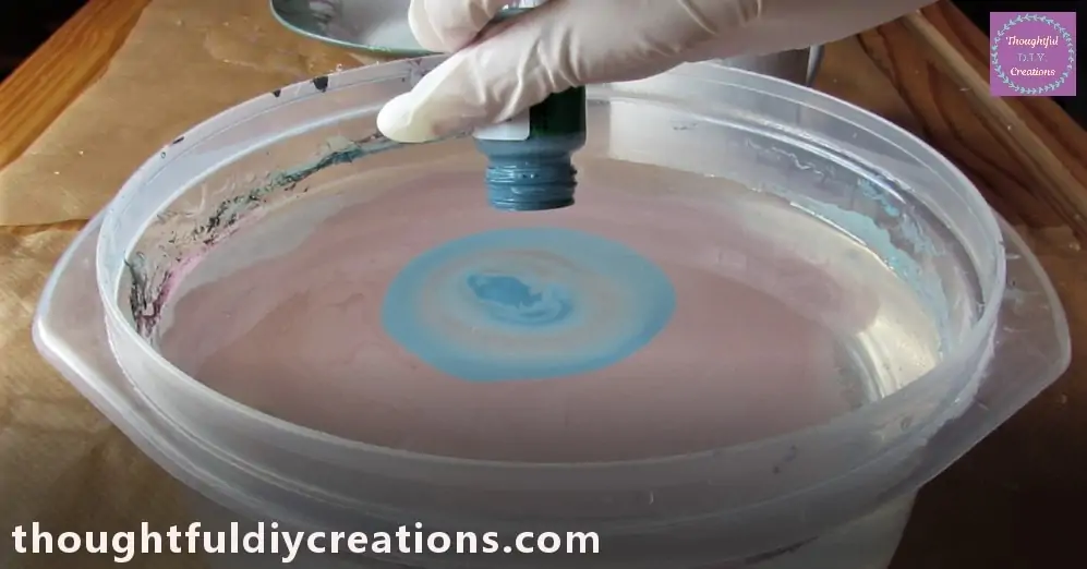 I held the Bottle Close to the Water and Dripped a few Drops into the Bowl.