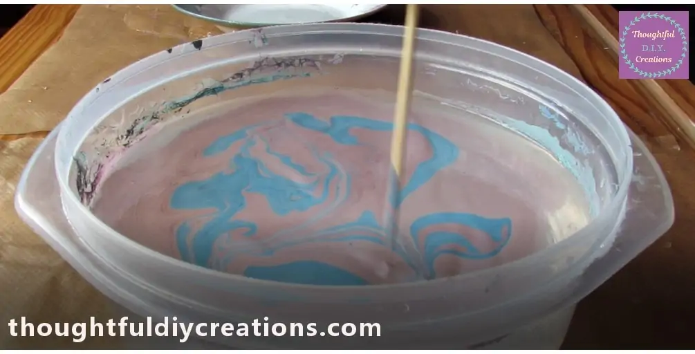 I got One of the Wooden Skewers and moved it around randomly in the Water making a Design from the Marbled Colours.