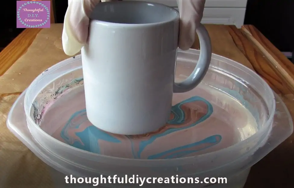 I got my Cup and held it over the Marbled Water.