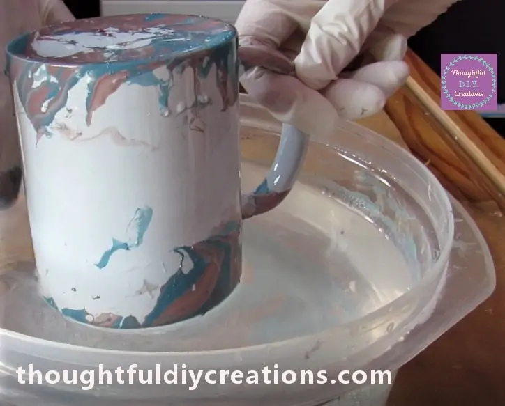 Removing the Cup from the Water.