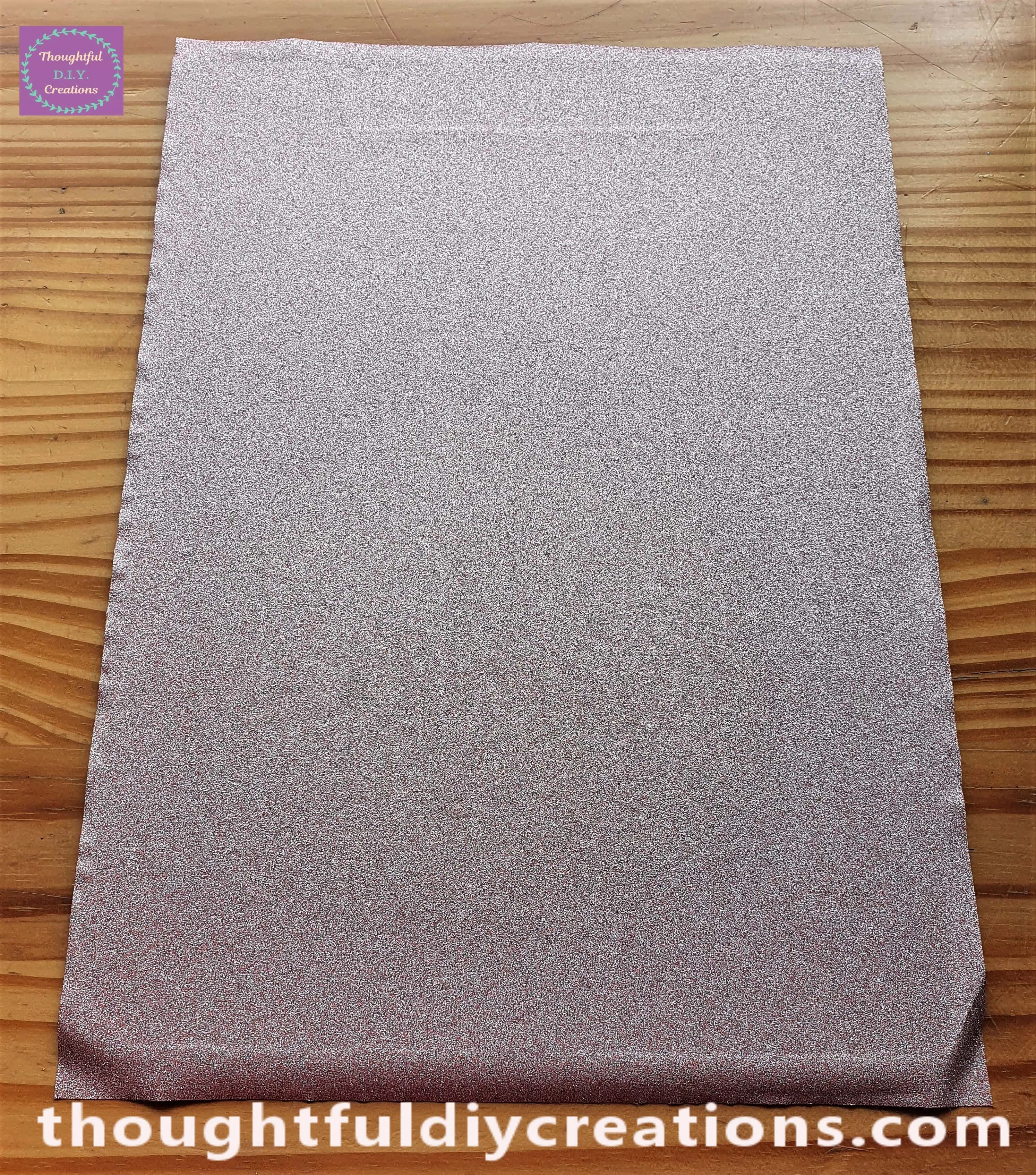 I pressed the Squeegee Tool from the middle of the Clipboard to the outer edge. I then put it back in the middle and pressed it out to the other edge removing the wrinkles in the process.