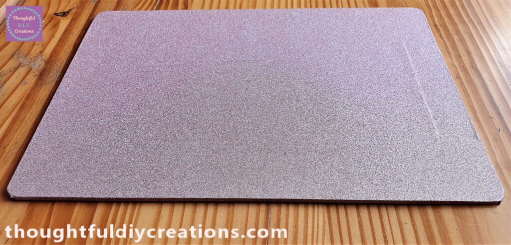 I attached the Glitter Paper to each Side by pressing each section of the Paper to the Board.