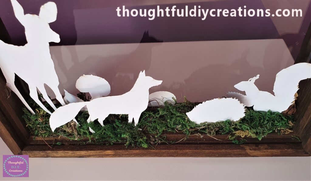 I hot glued a Fox, Snail, Hedgehog and a Squirrel to the Frame.