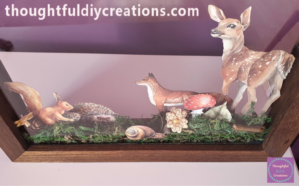 The Front of the Frame. I also added a Pine Cone and Flower beside the Squirrel.