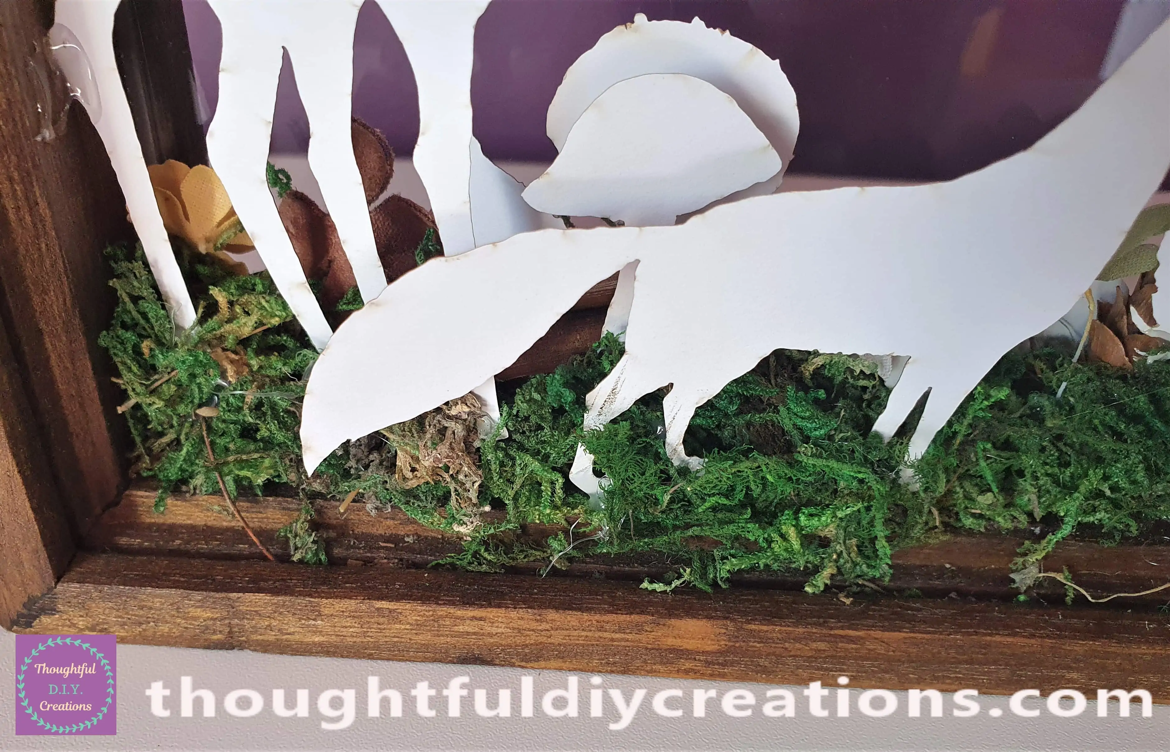 I placed a yellow and brown fabric flower beside the Deer. I hot glued another Mushroom behind the first Mushroom.