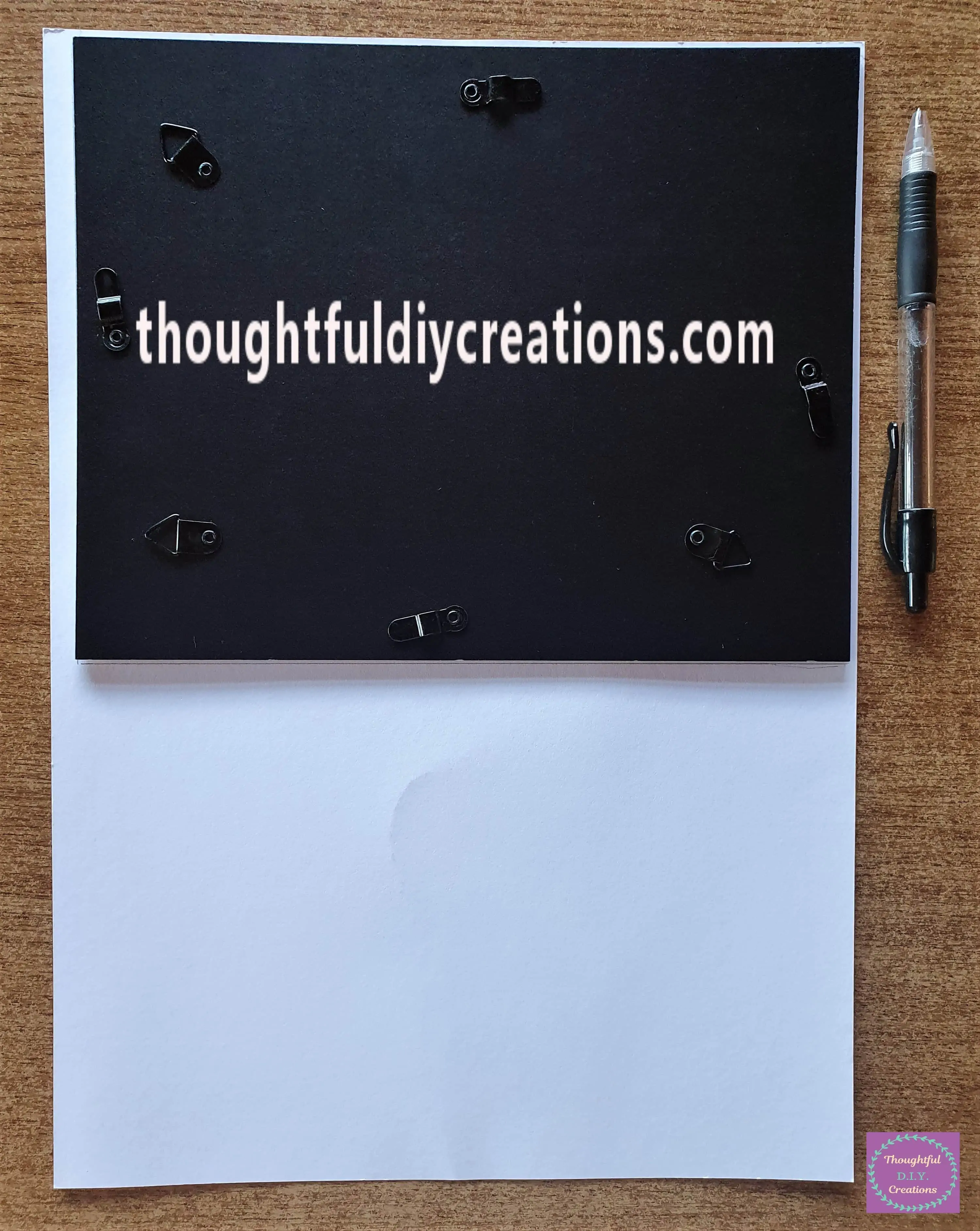 I put the Back of the Frame on the Back of the Cardstock and drew around it with a Pencil.