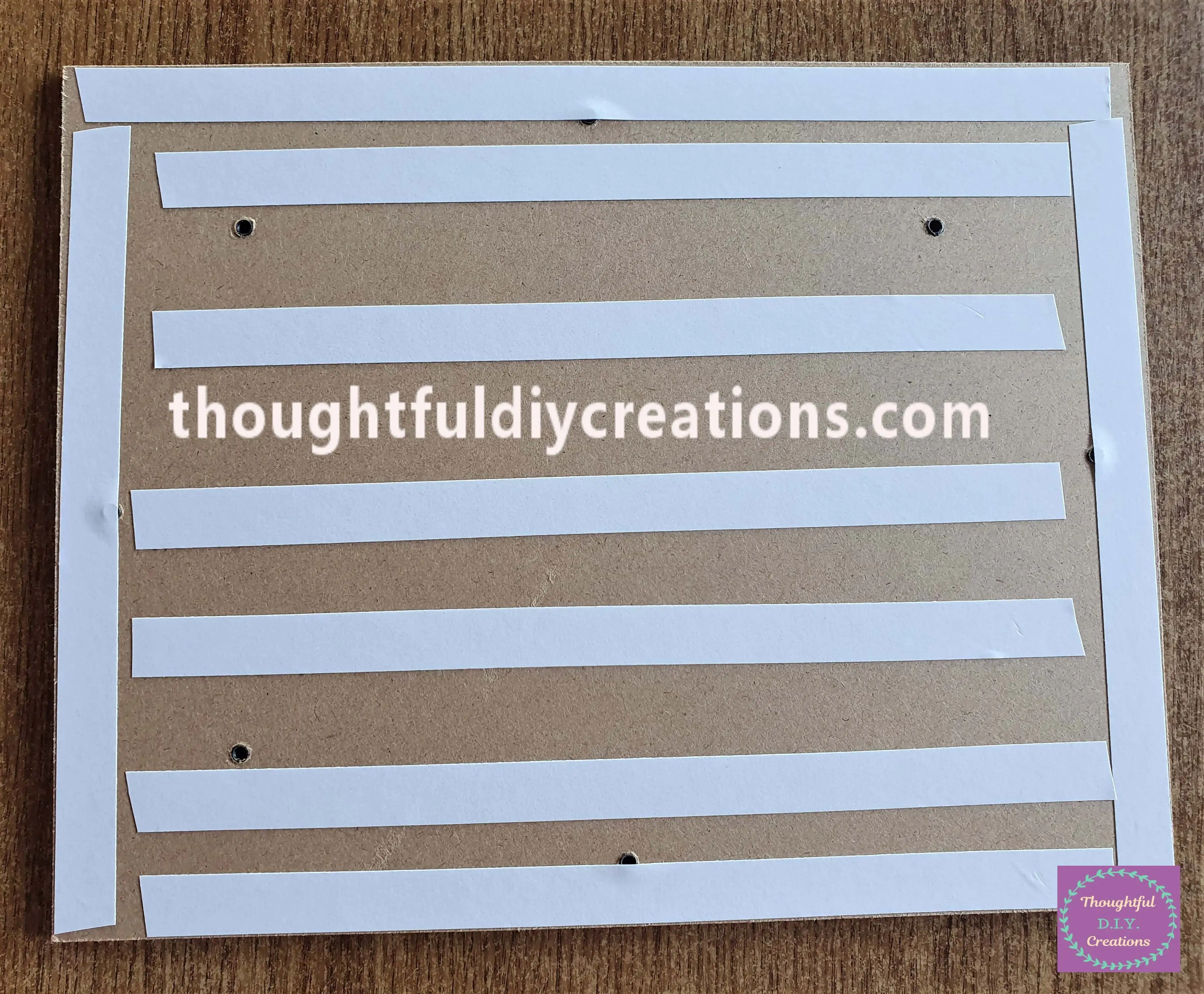 I put Strips of Double-Sided Tape all over the Board for the Frame.