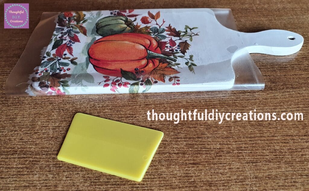 The Napkin being attached to the Side of the Chopping Board.