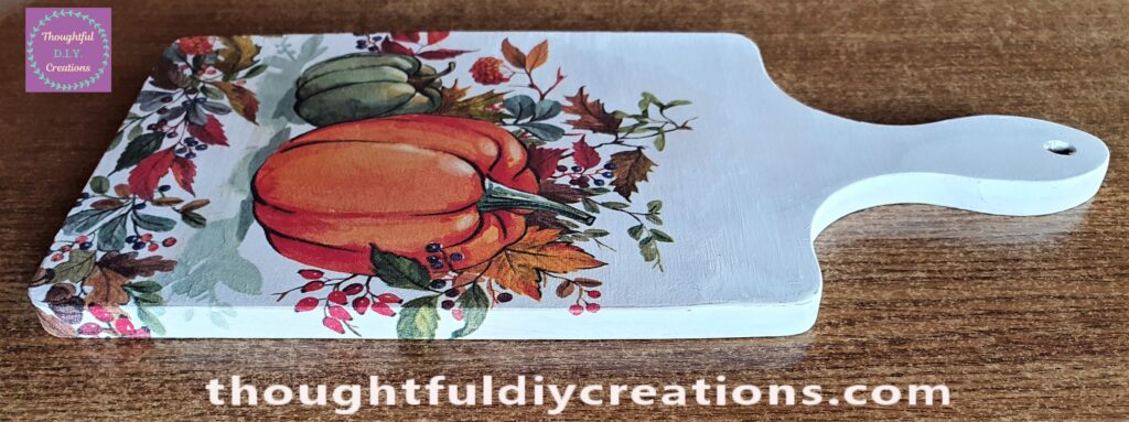 A Side View of the Napkin Decoupaged to the Chopping Board.