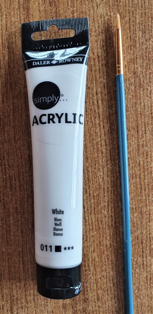 I got my White Acrylic Paint and a small Paintbrush.