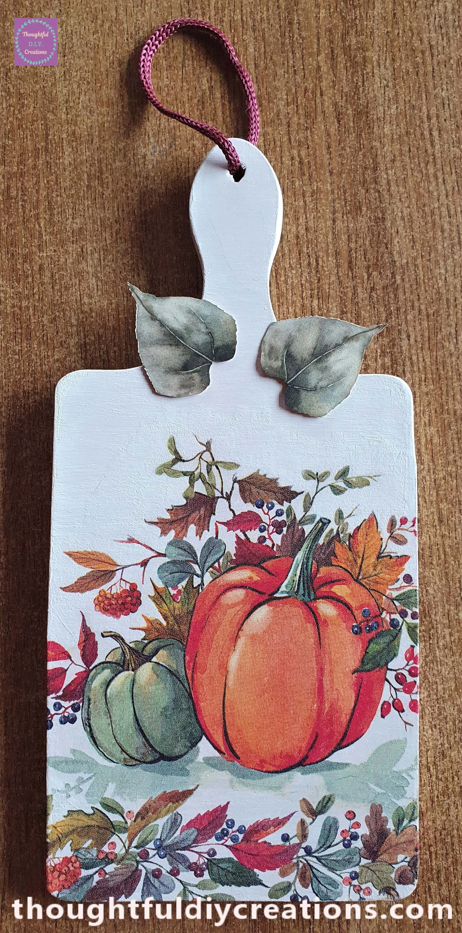 I put a dab of hot Glue behind each leaf and attached them to the top of the Chopping Board.