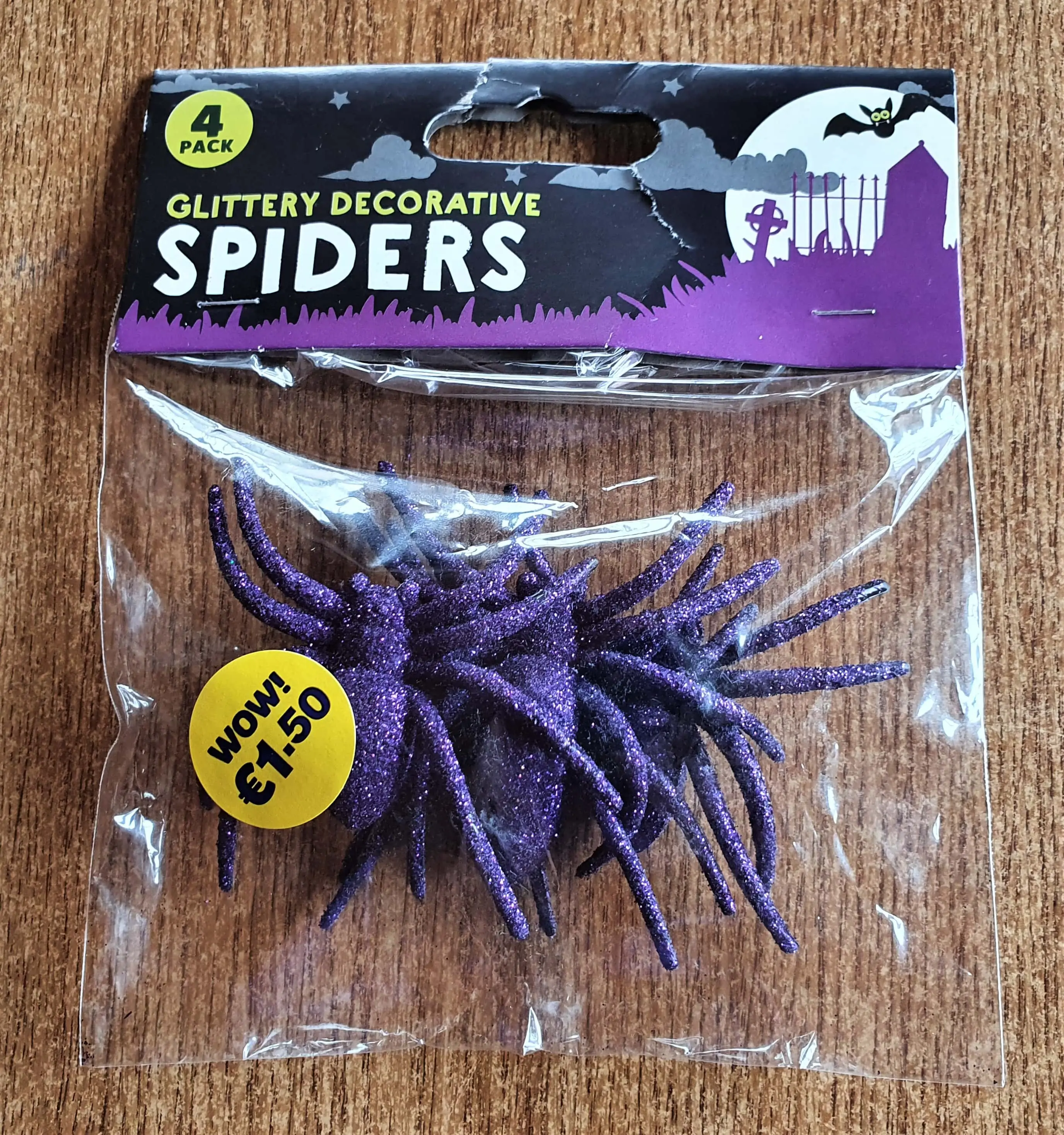 I bought a 4 Pack of Purple Glitter Spiders from my local EuroGiant Store.