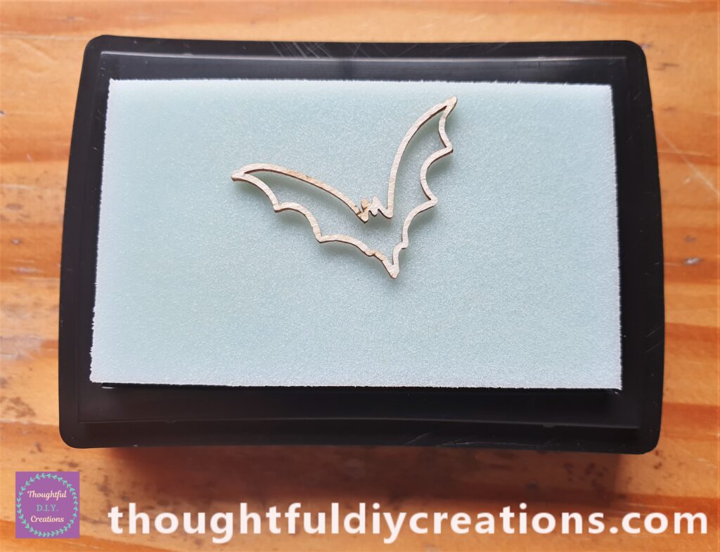 I put the Bat face down on the Ink and pressed it into the Ink with my fingers.