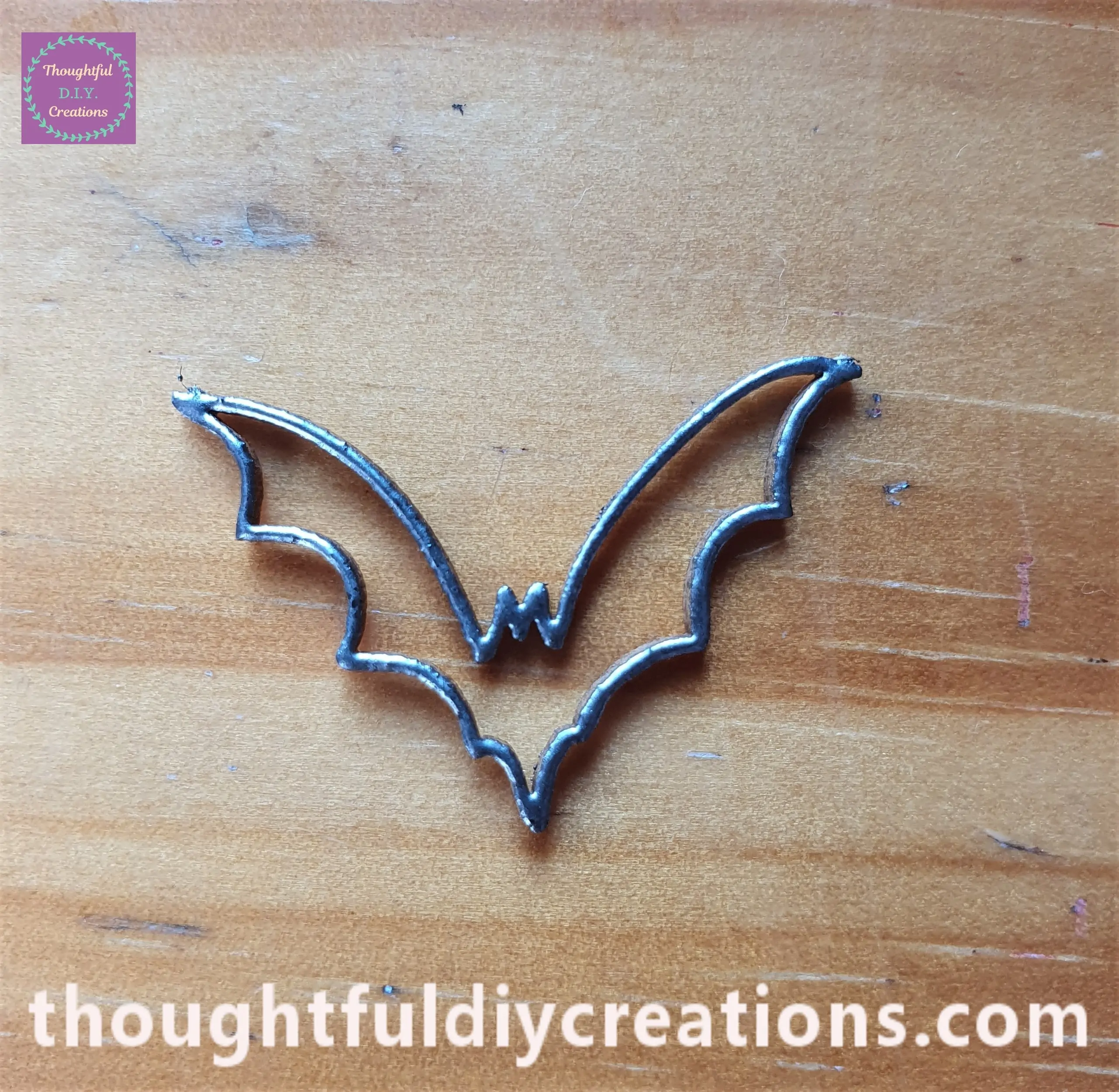 The Heat Tool melts the Embossing Powder into the Chipboard and it results in a metallic permanent finish.