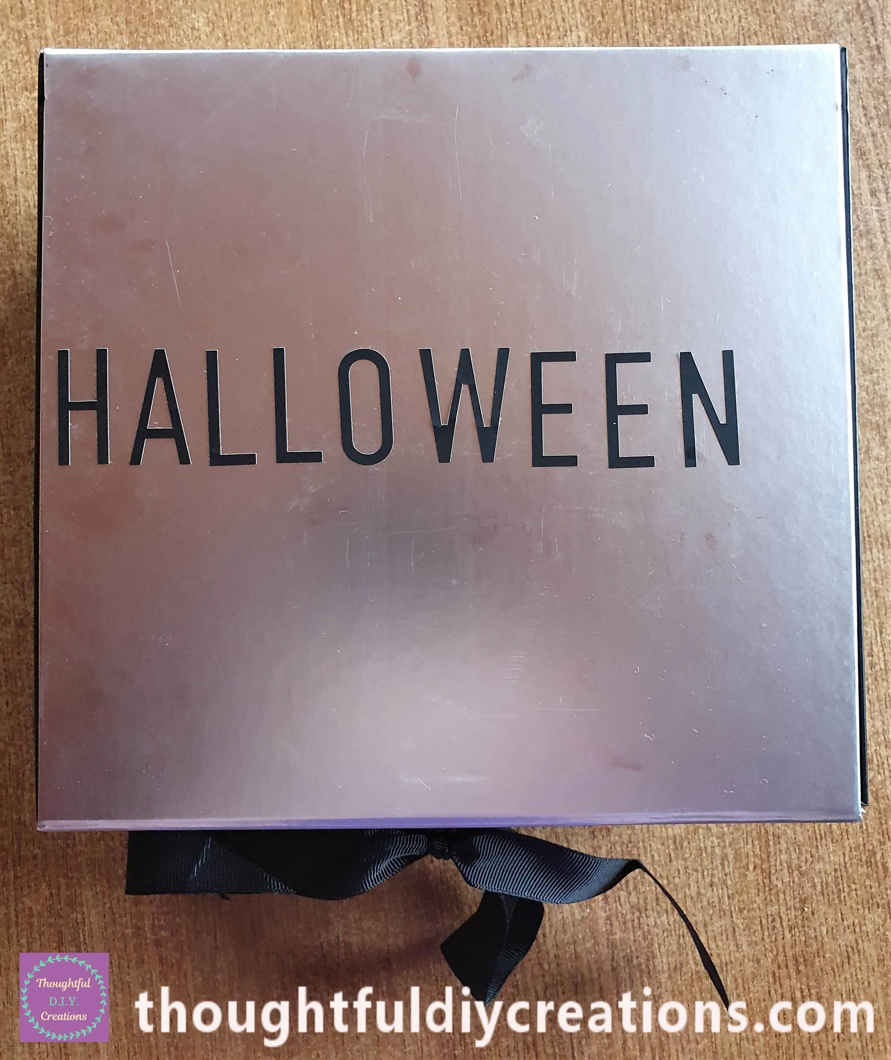 I got the Alphabet Stickers and stuck down the Letters to spell the word HALLOWEEN across he center of the Box.