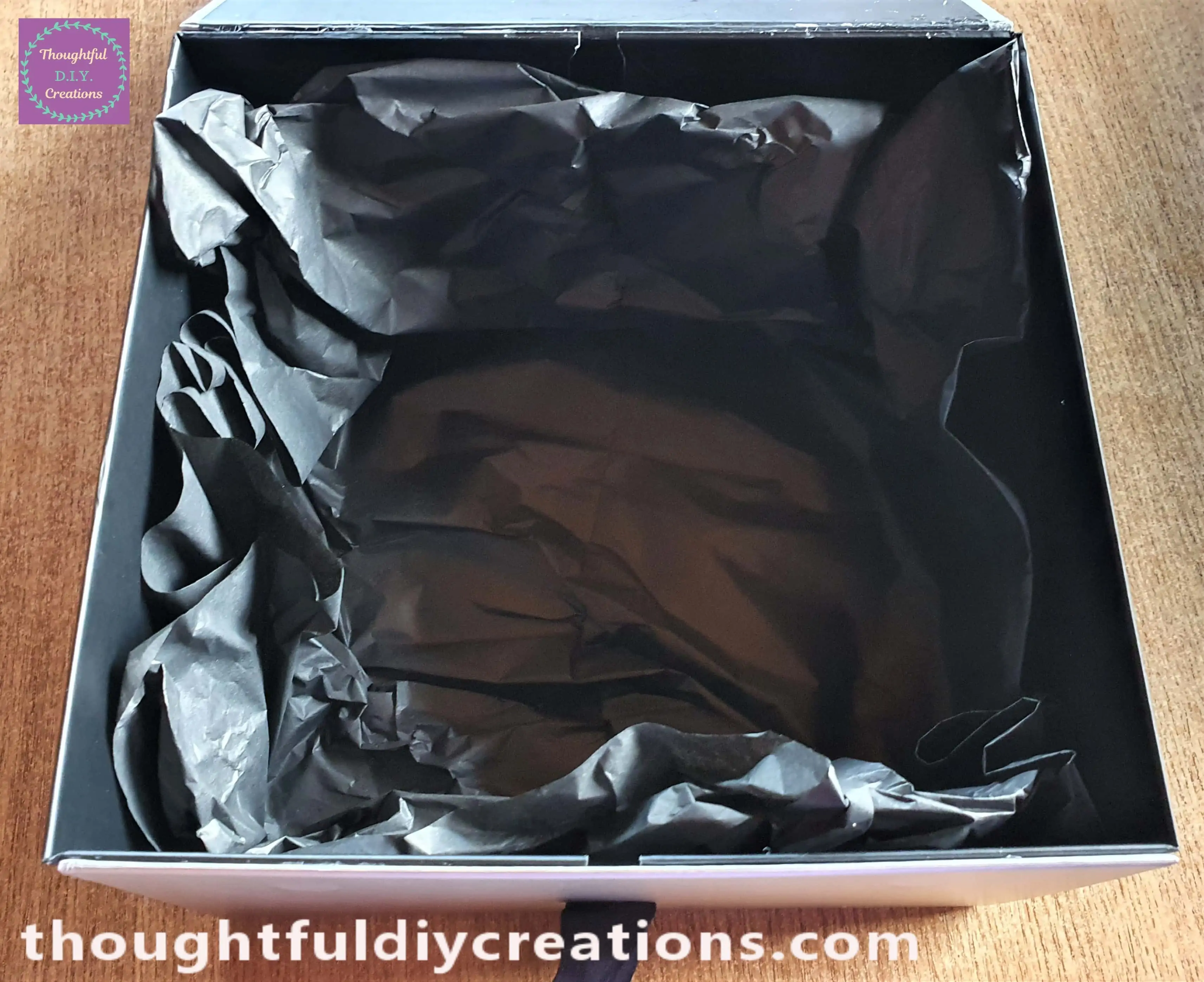 I put one Sheet of the Tissue Paper Inside the Gift Box and scrunched it into place.