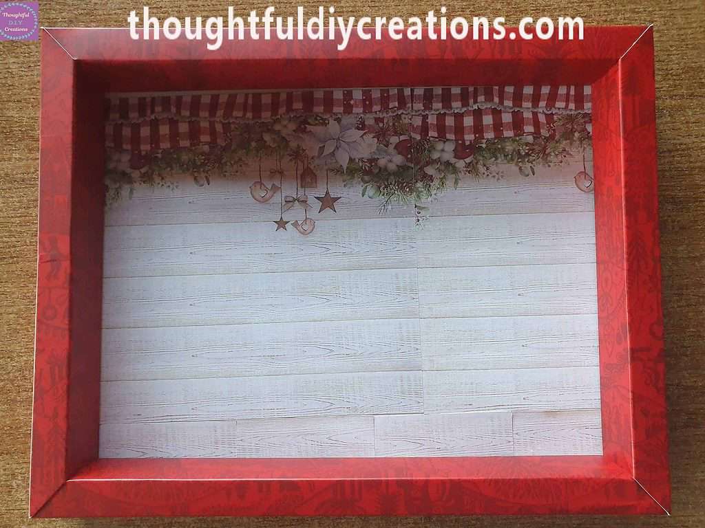 I put Double-Sided Tape on the back of each Strip and attached them to the bottom of the Christmas Shadow Box.