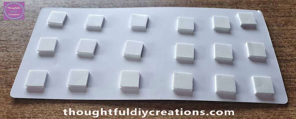 I put 3-D Foam Squares on the back of the Door.