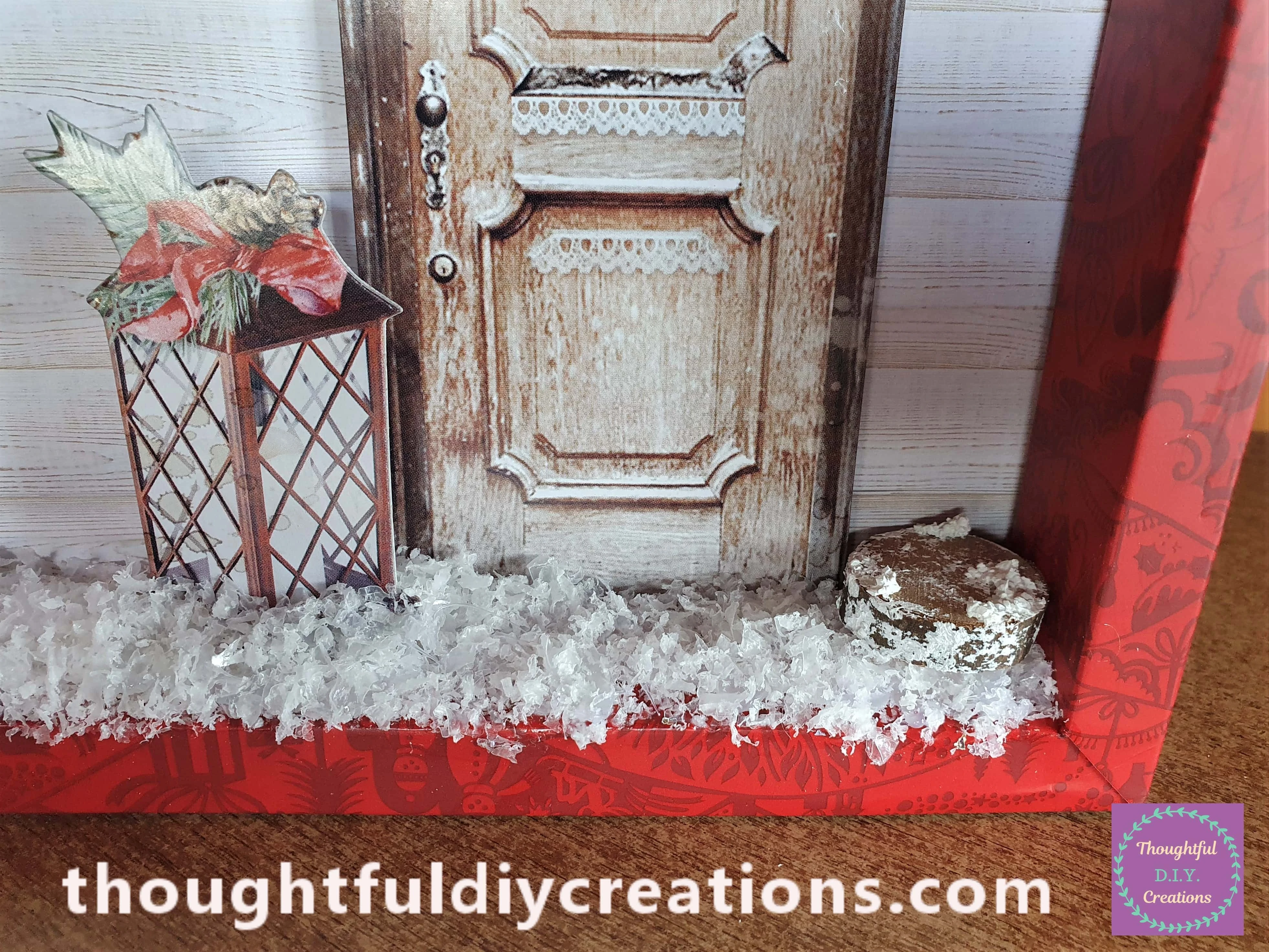 I put Snow Paste on a Wood Slice and attached it to the edge of the Shadow Box with Hot Glue.