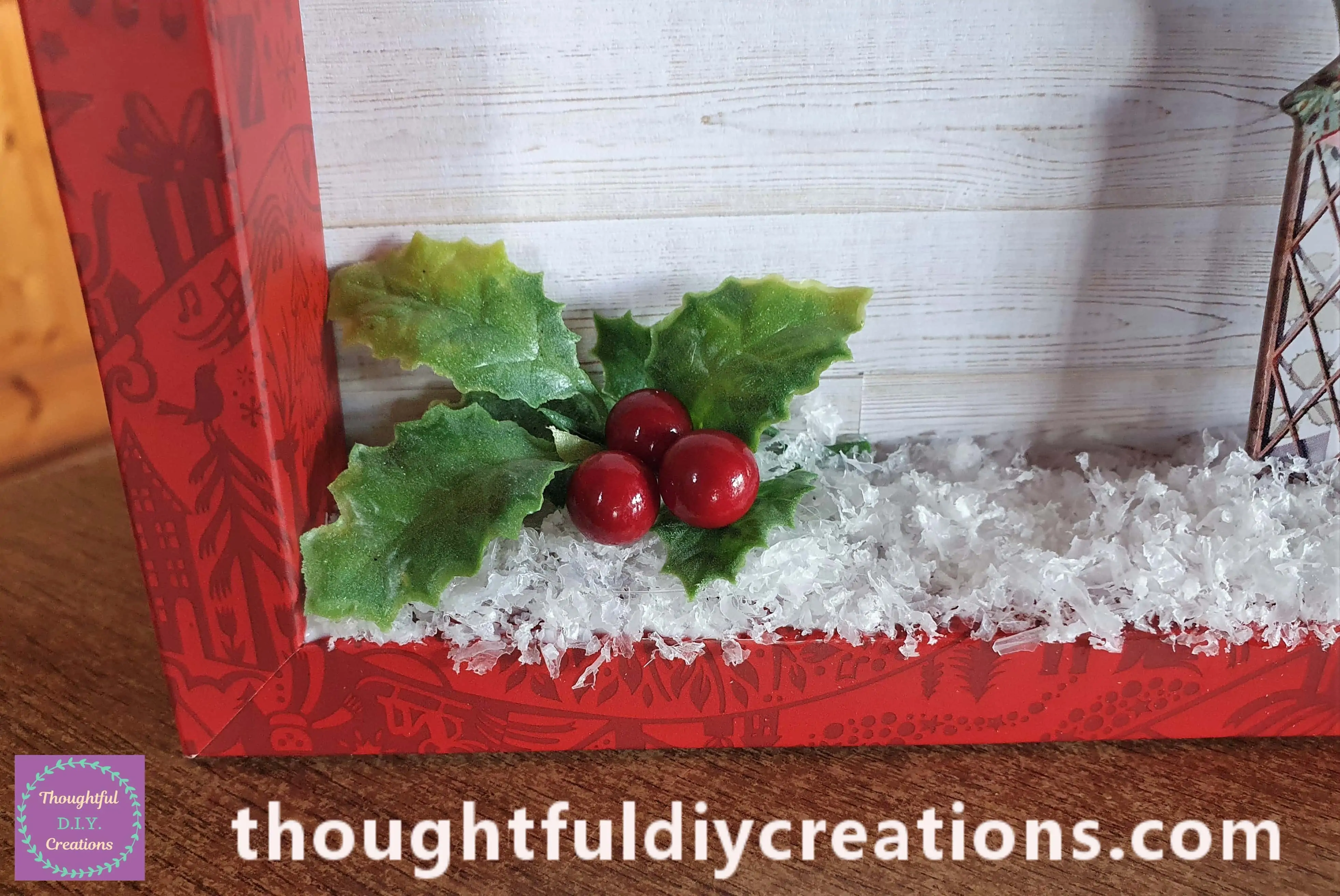I put Hot Glue on the Leaves and pressed them into the Snow. I then added each berry one-by-one with Hot Glue.