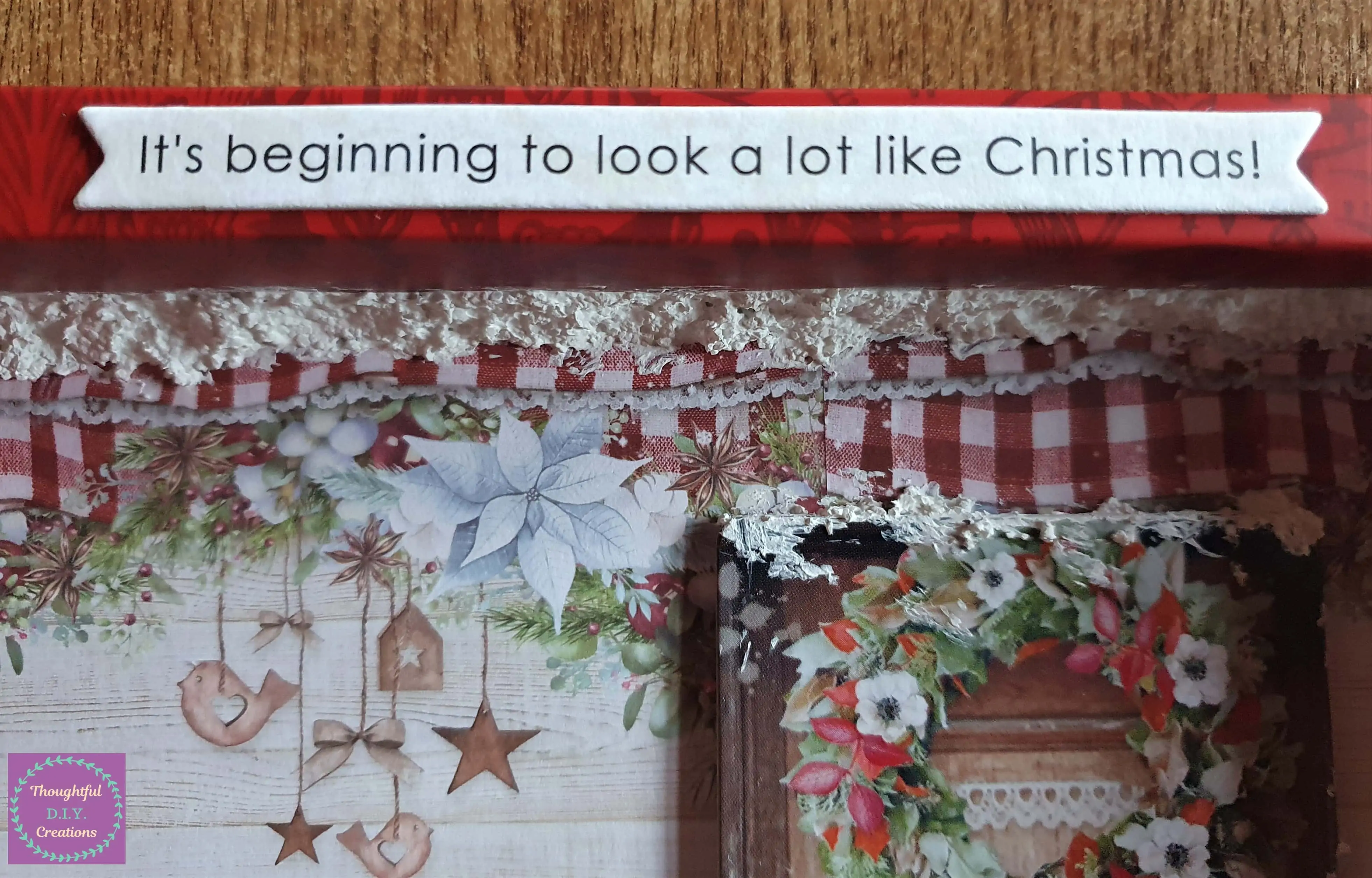 I attached a Christmas Cardboard Sticker to the Center of the Frame.