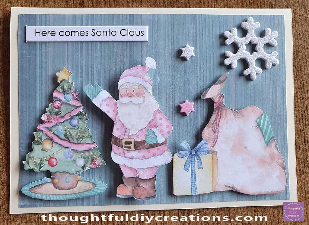 I placed the Christmas Sentiment on the Top-Left Side of the Card and the 2 Star Stickers in between the Santa and the Snowflake/ Sack.